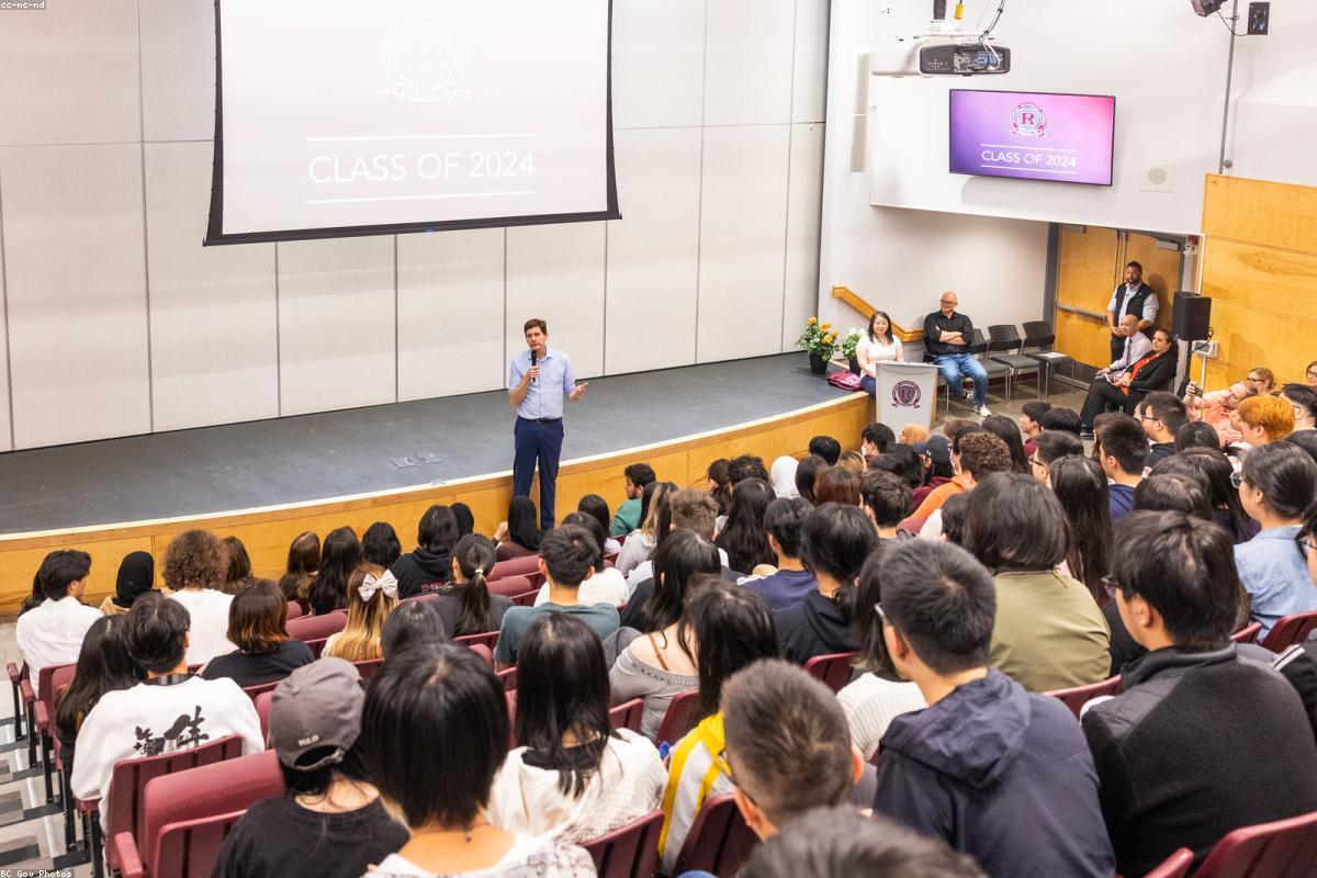 Students seated in a school assembly hall